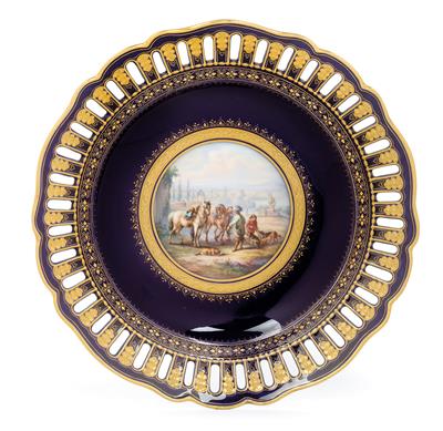 A plate decorated with equestrian scene, - Works of Art