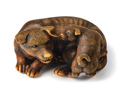 An ivory netsuke of a dog with puppy, Japan, Edo period, 19th century, signed Okatomo, - Mobili