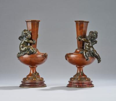 Auguste Moreau, a pair of lamp bases or pedestals for bowls or candlesticks, with seated putti, France, c. 1900 - Secese a umění 20. století