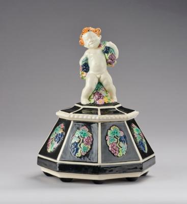 A lidded box with finial in the form of a faun with floral garlands, model number 1767, Wiener Kunstkeramische Werkstätte (WKKW), c. 1914 - Secese a umění 20. století