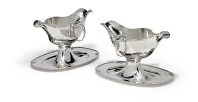 A pair of gravy boats, - Silver and Russian Silver