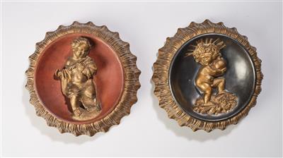 Michael Powolny, two round reliefs: a Christ putto with globus cruciger and skull, and a striding putto with cape, designed in c. 1936/37 - Jugendstil e arte applicata del XX secolo