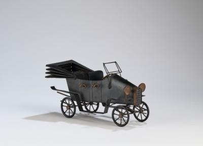 An antique racing car, in the style of Werkstätte Hagenauer, Vienna - Jugendstil and 20th Century Arts and Crafts