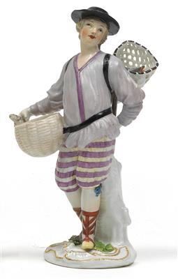 A figure of a fisherman with fish in a basket and in a net, - Glass and porcelain