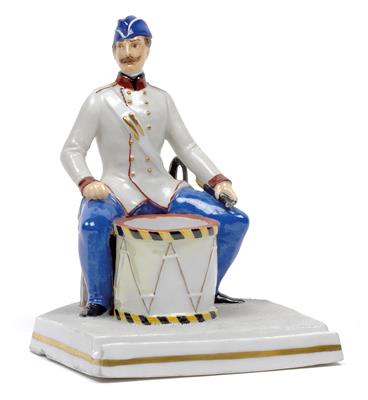 A figure of a drummer with ink set, - Glass and porcelain