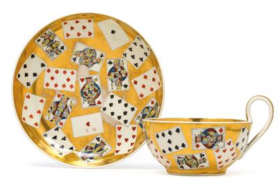 A teacup and saucer decorated with playing cards, - Sklo, Porcelán