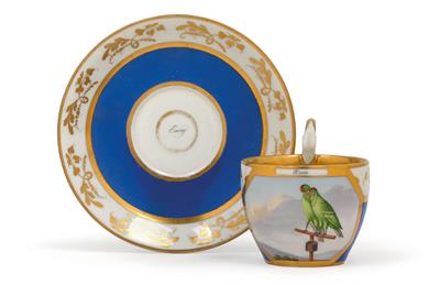 A cup with billing budgerigars and saucer, - Glass and porcelain