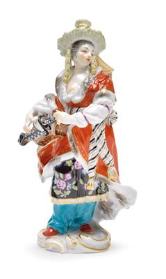 A Malabar figure playing the hurdy gurdy, - Glass and Porcelain