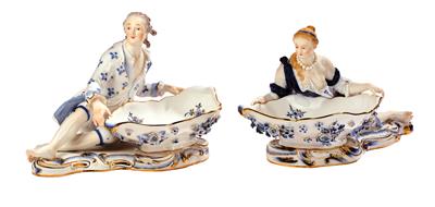 A Pair of Porcelain Centrepieces with a Recumbent Gentleman and Lady Holding Bowls, - Sklo a Porcelán