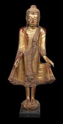 Burma (Myanmar): a standing Buddha figurine, gilded with gold leaf. Style: Mandalay. - Tribal Art