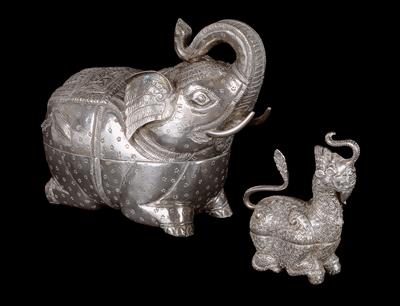 Mixed lot (2 pieces), Cambodia: two lidded boxes made of high-quality silver. One box in the form of an elephant, the other representing a guardian lion (‘chinthe’). - Tribal Art
