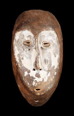 Lega (also Warega or Rega), Dem. Rep. of Congo: an ‘idimu’ face mask, made from lightweight, light-coloured wood, with a white kaolin coating. - Tribal Art