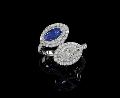 A diamond and sapphire ring - Klenoty