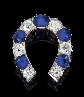 A diamond and sapphire horseshoe brooch - Gioielli